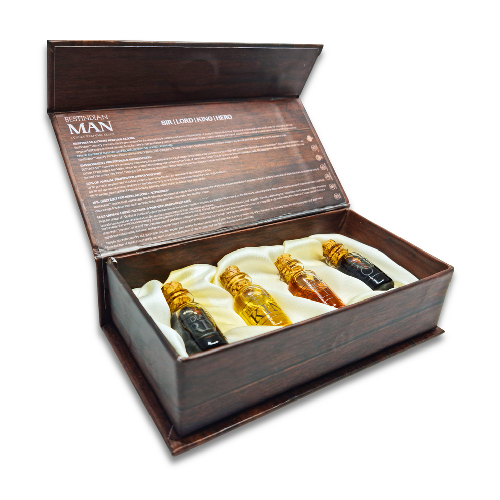 Open wooden-themed box with satin cushion holding four miniature dab-on perfume oils by BestIndian™.