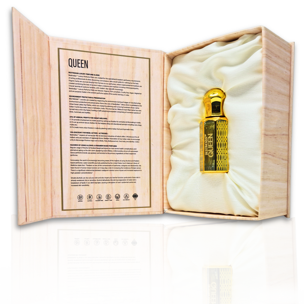 Opened luxury wooden box revealing BestIndian™ Queen nestled in plush satin cushioning with detailed product information panel, displaying this sophisticated oriental oud perfume for women with vetiver and sandalwood notes in its elegant roll-on bottle presentation.