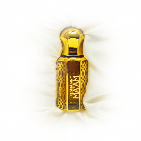 Ma'am luxury perfume oil in its elegant golden vial, creamy white background. Best Indian Perfumes.
