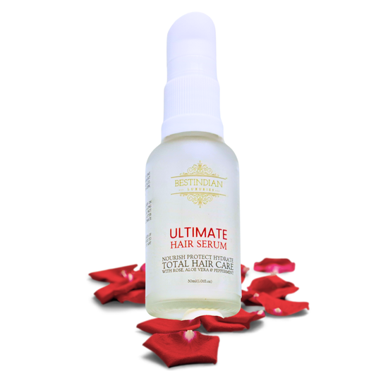 White bottle against white background of Ultimate hair Serum by Best indian Total hair care serum with Rose, Aloe Vera and Peppermint.