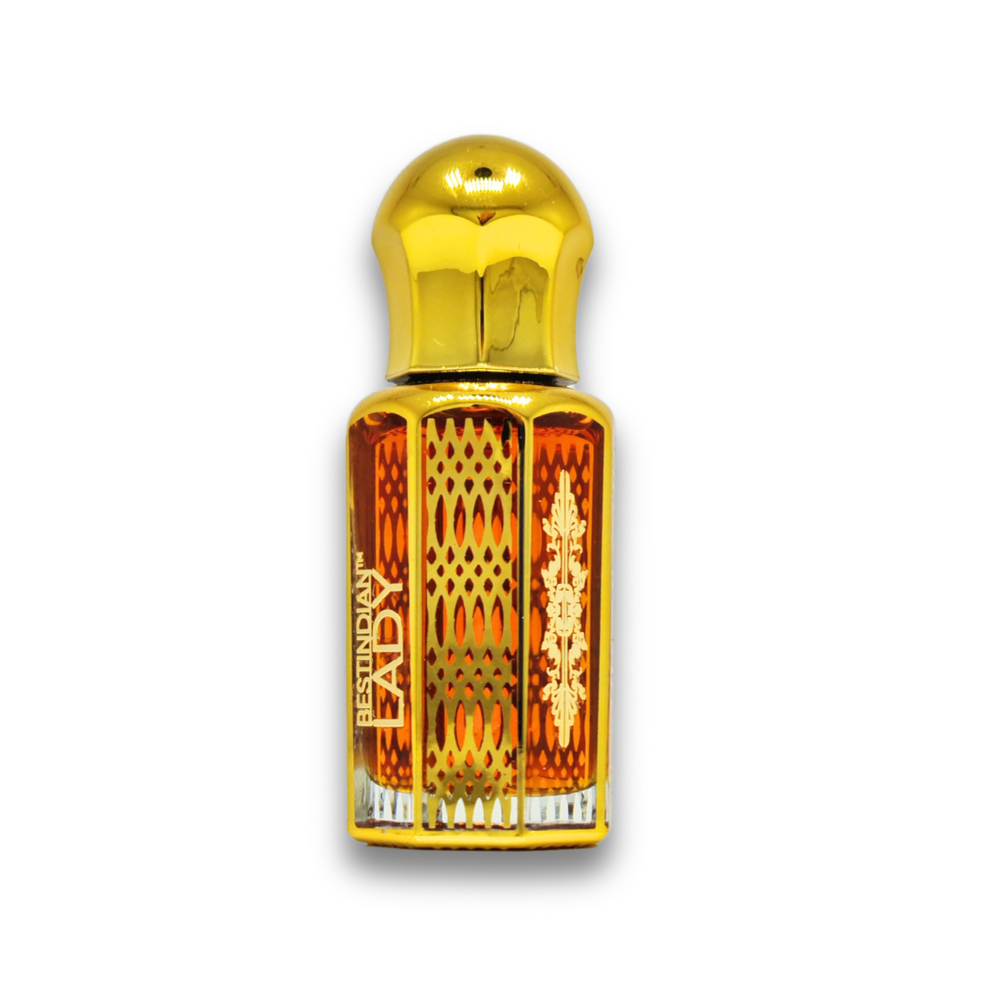 Ornate golden vial of Best Indian Attar for women: Lady Perfume Elixir showcasing its rich red coloured natural oil.