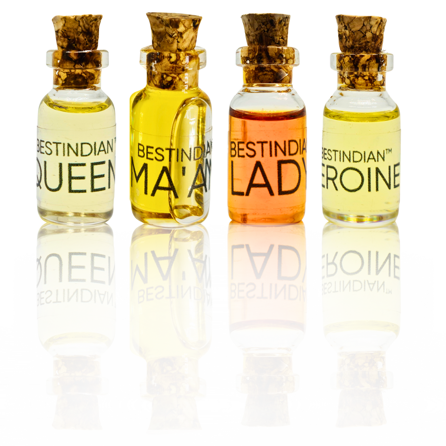 BestIndian™ Woman miniature perfume set for women — four attar vials with cork pullout caps, featuring elegant miniature bottles labeled Queen, Ma’am, Lady, and Heroine, perfect as a travel-friendly perfume discovery set or vegan cruelty-free gift for her.