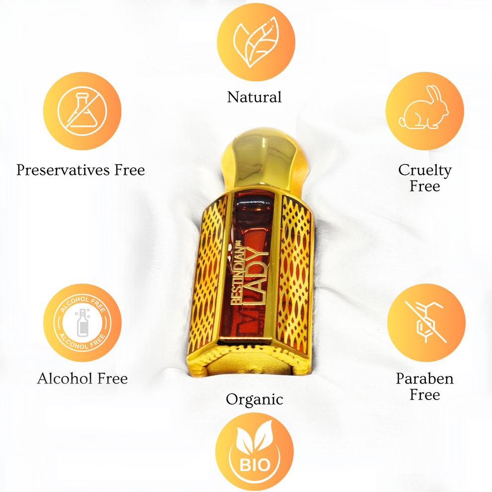 Close-up of ornate golden bottle of the best alcohol-free perfume for women: Lady Elixir by BestIndian™ presented on its cream cushion, surrounded by USP listing icons including those of Natural, Organic, Paraben-free, Preservatives-free, Cruelty-free.