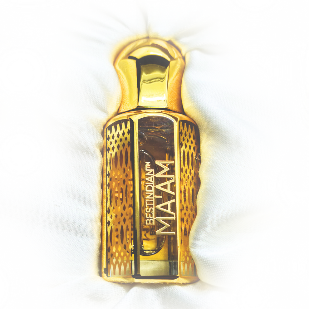 Bes tIndian Perfume for women Ma'am luxury perfume oil in its elegant golden vial, white background. Alcohol-free and 100% Natural Ittar fragrance for women.